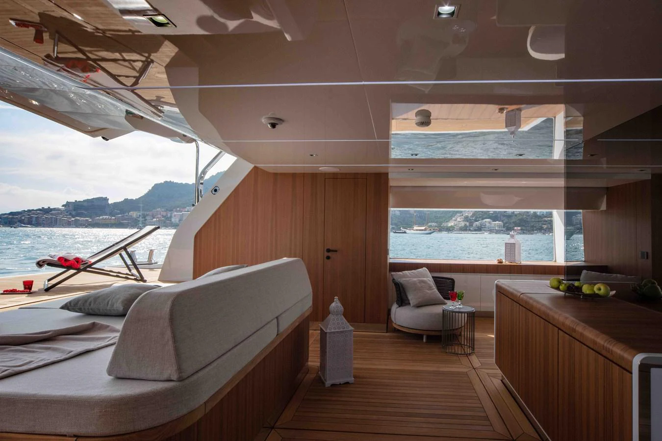 a room with a couch and a table and a window aboard MA Yacht for Sale