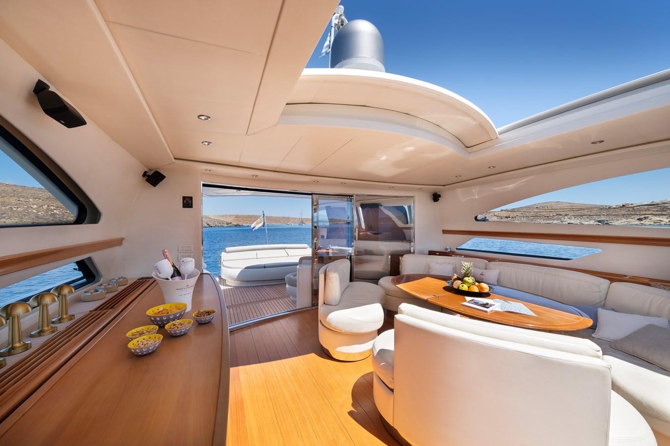 a modern looking living room with a large open ocean aboard ICE Yacht for Sale