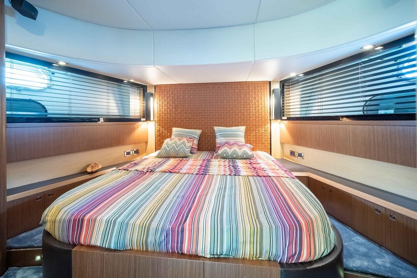 a bed in a room aboard CHARISMA Yacht for Sale