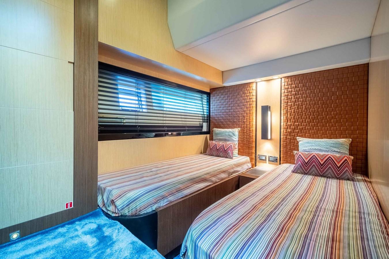 a room with two beds aboard CHARISMA Yacht for Sale