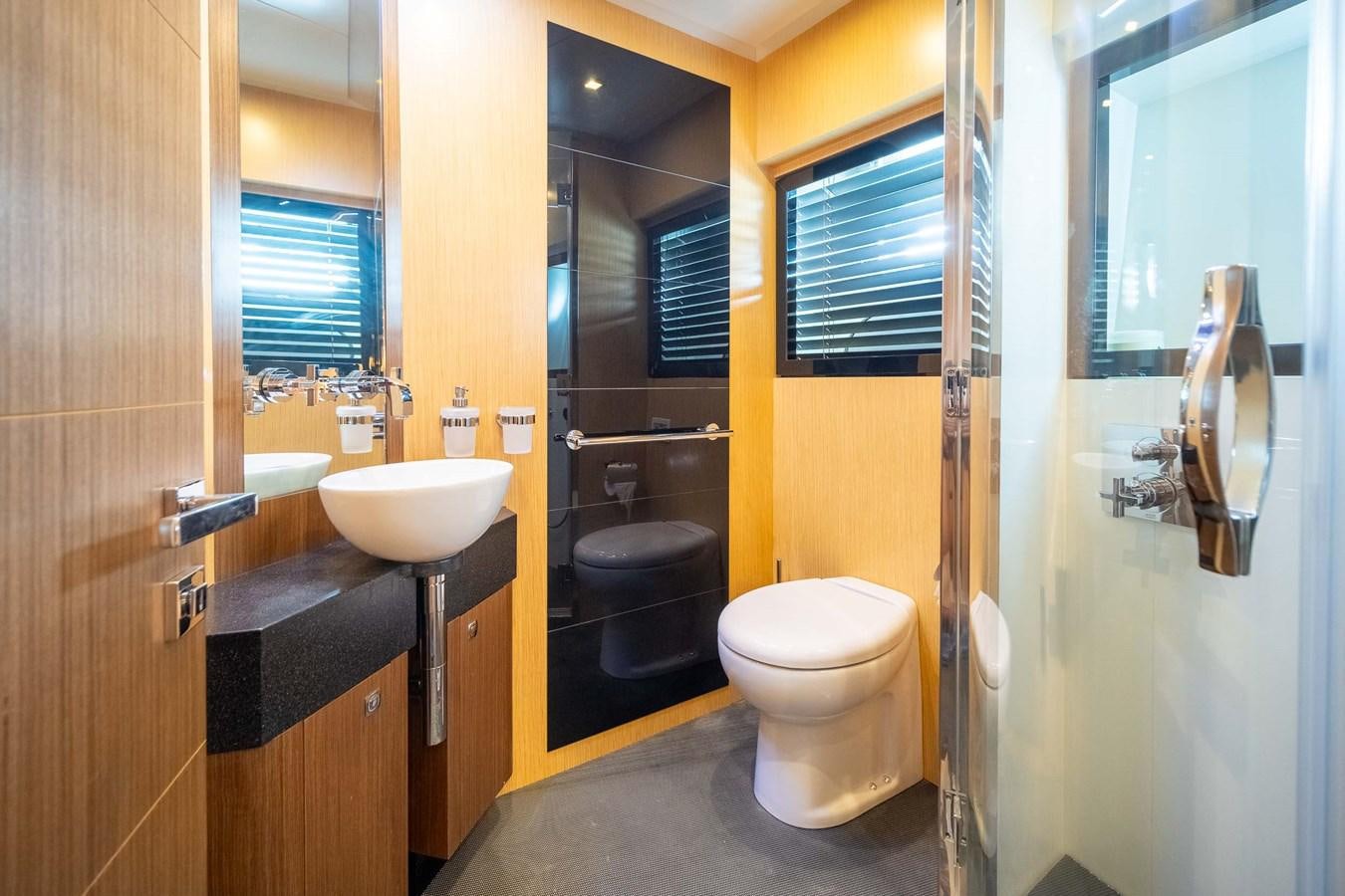 a bathroom with a sink toilet and a bathtub aboard CHARISMA Yacht for Sale