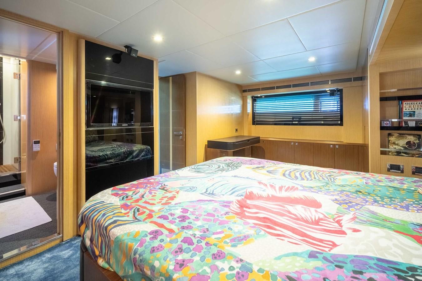 a bedroom with a bed and a closet aboard CHARISMA Yacht for Sale