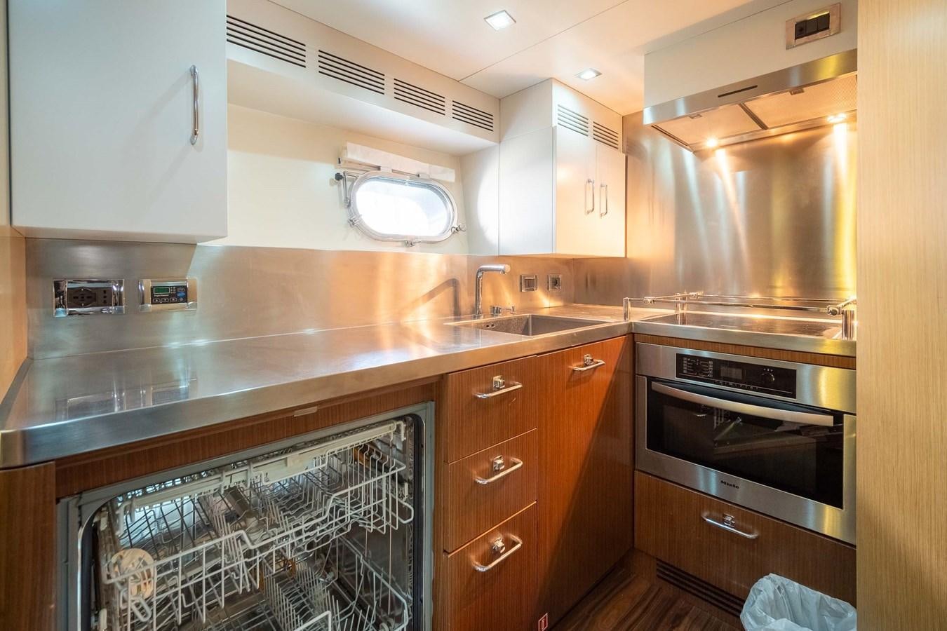 a kitchen with a stove and oven aboard CHARISMA Yacht for Sale