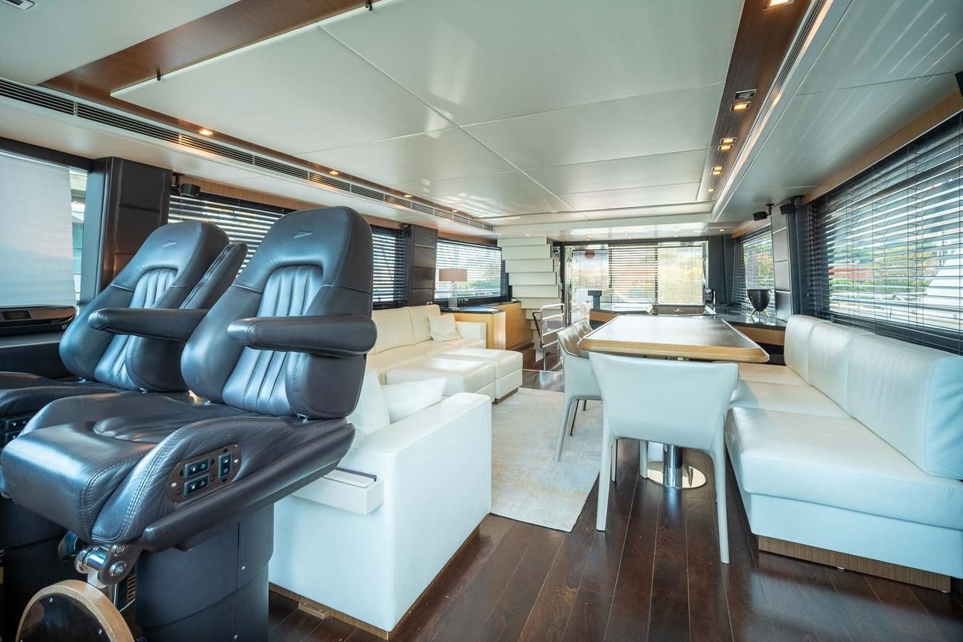 a living room with a couch and a table aboard CHARISMA Yacht for Sale