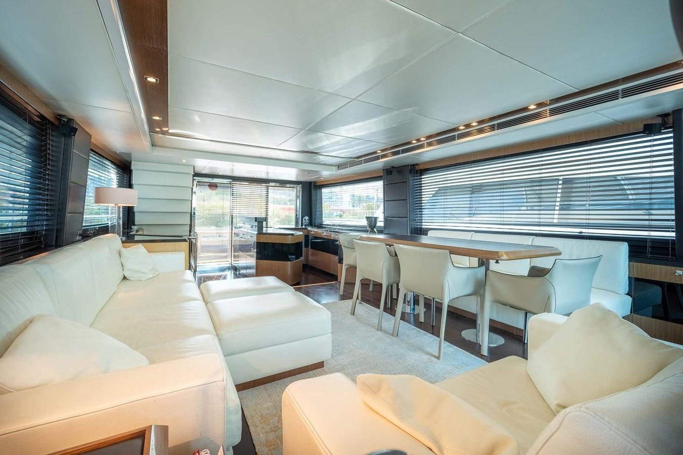 a large living room with a large window aboard CHARISMA Yacht for Sale