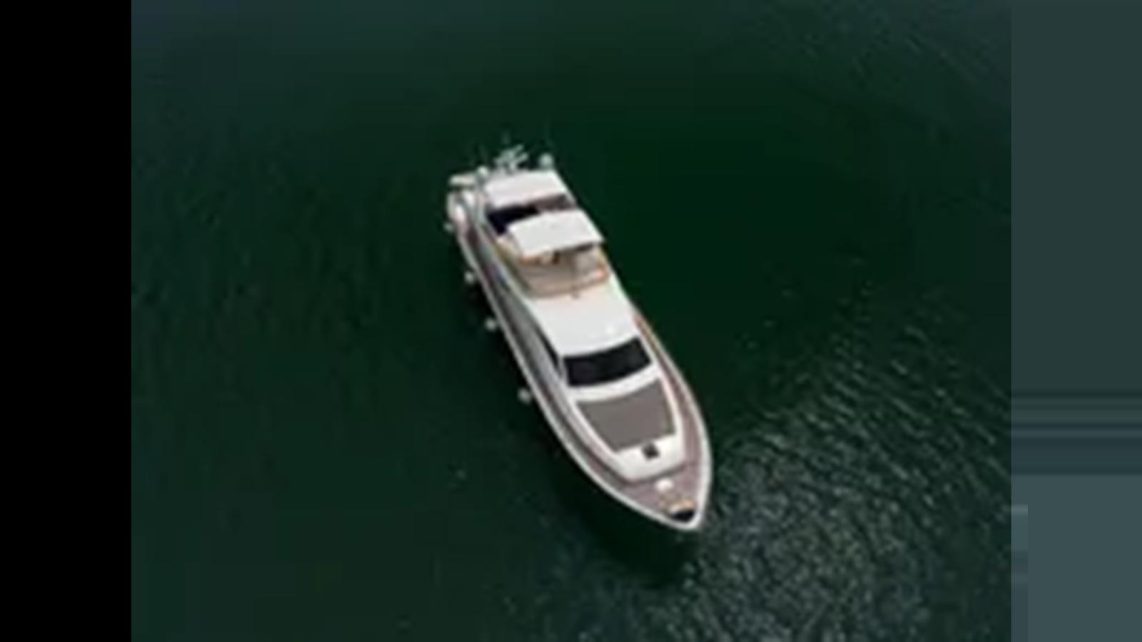 a white boat on a green surface aboard 2004 FERRETTI YACHTS 810 Yacht for Sale