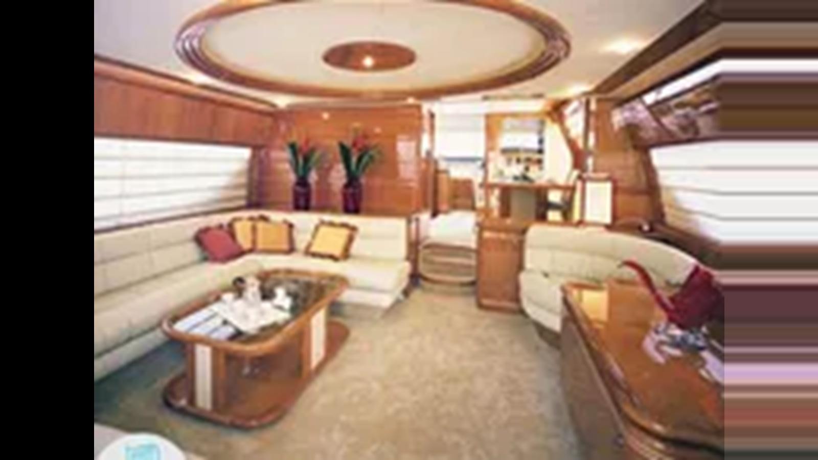 a living room with a couch and a table aboard 2004 FERRETTI YACHTS 810 Yacht for Sale