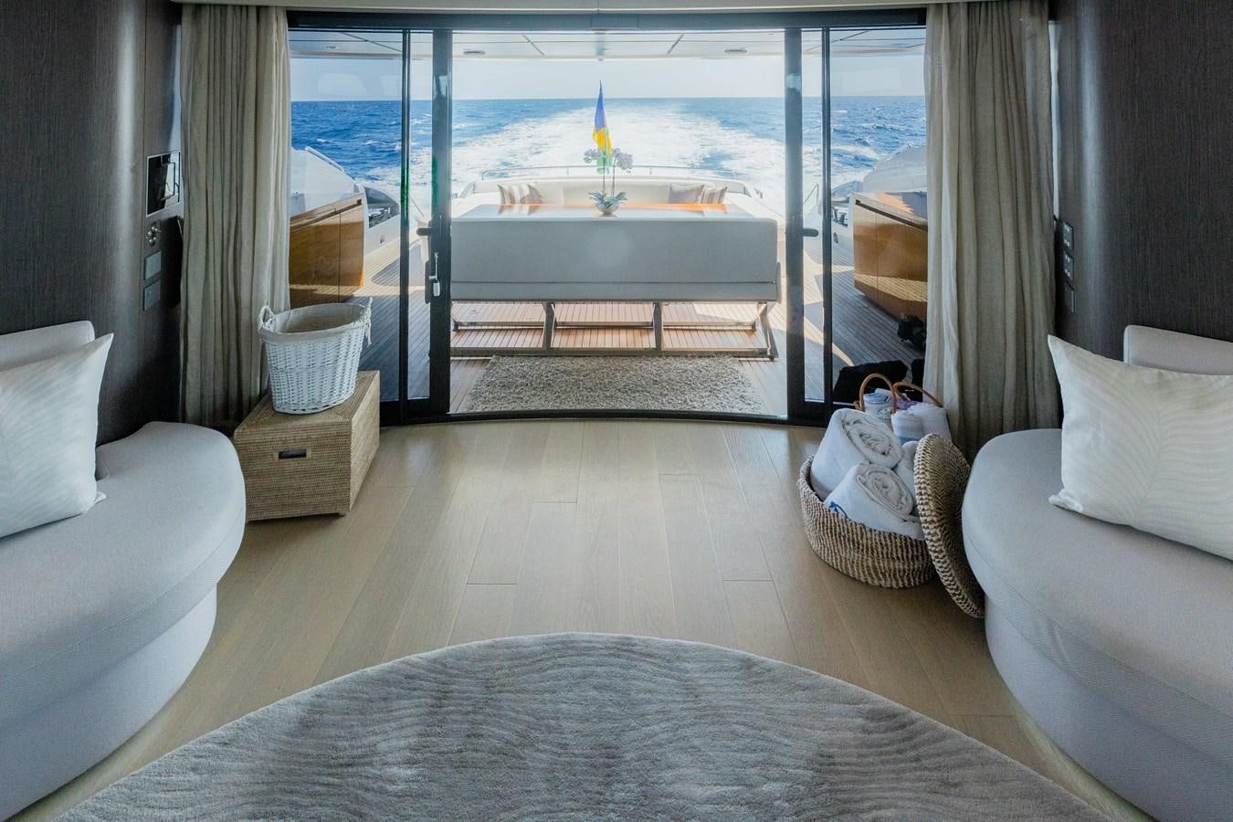 a room with a view of the water and a boat aboard KOLAHA TWO Yacht for Sale