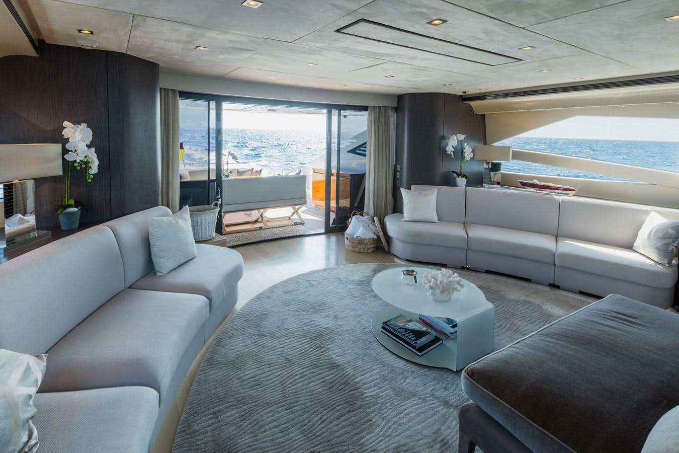 a living room with a large window aboard KOLAHA TWO Yacht for Sale
