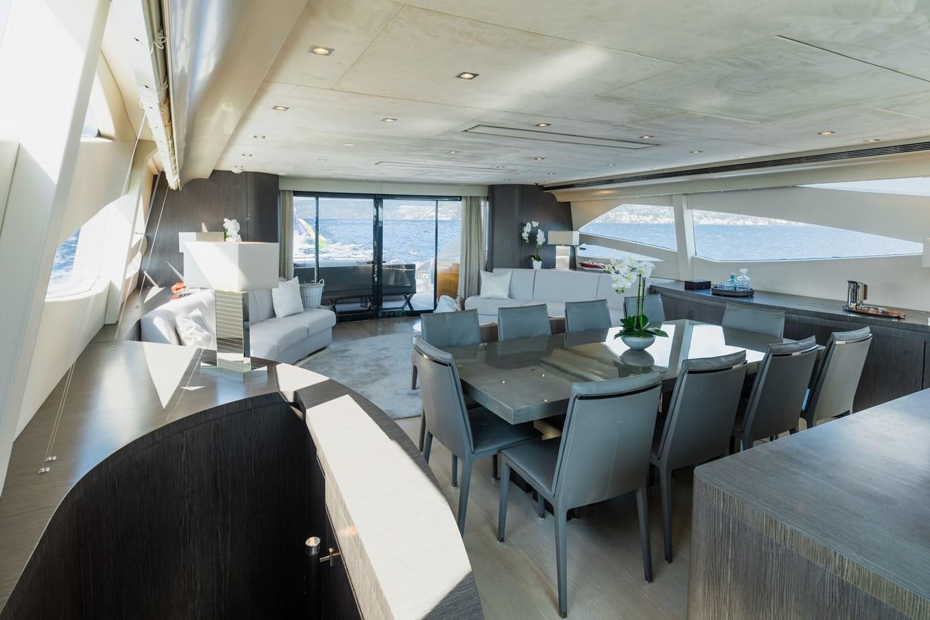 a room with tables and chairs aboard KOLAHA TWO Yacht for Sale