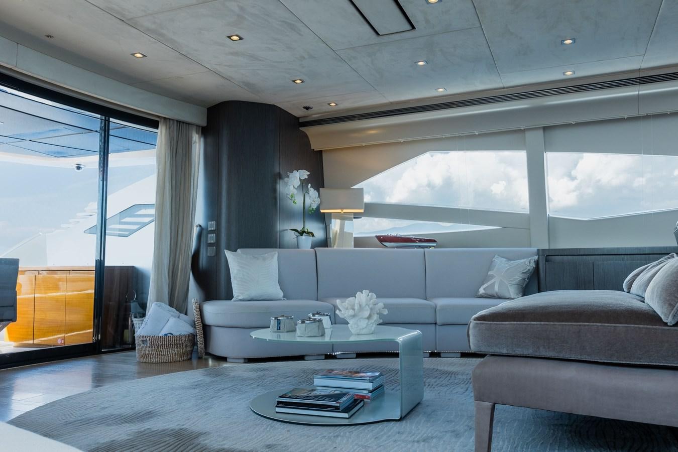 a living room with a large window aboard KOLAHA TWO Yacht for Sale