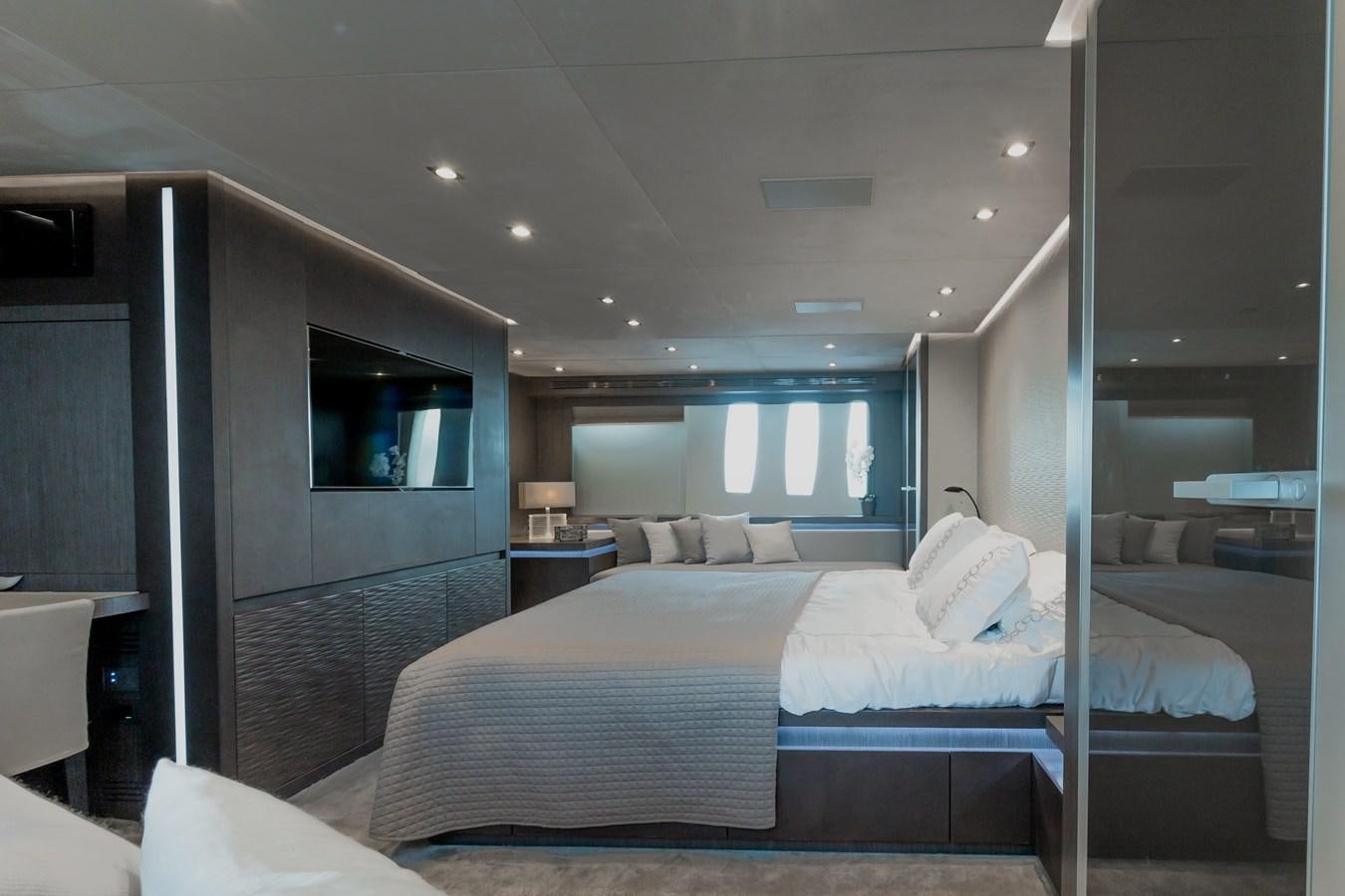 a room with a bed and a window aboard KOLAHA TWO Yacht for Sale