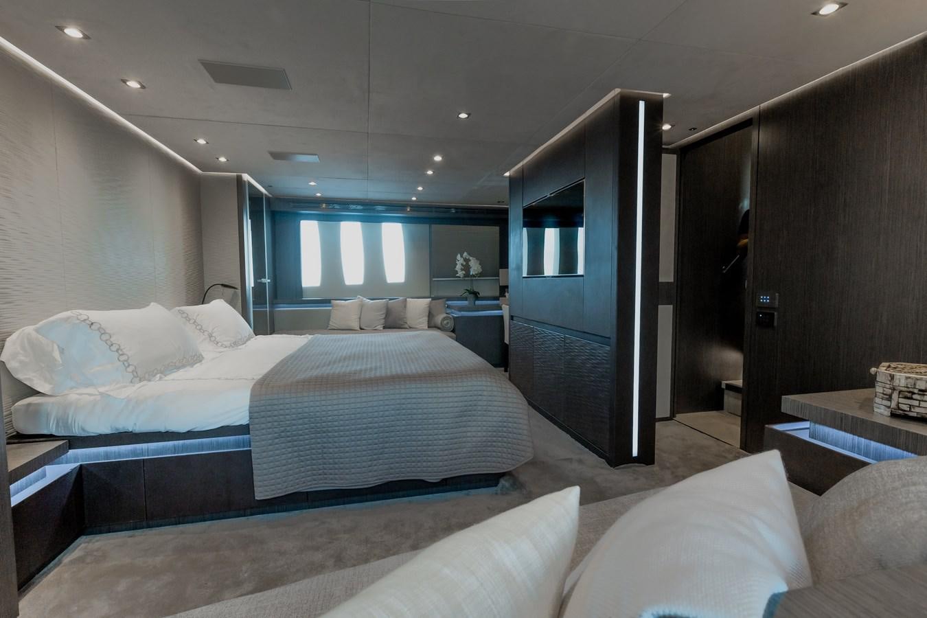 a room with a bed and a mirror aboard KOLAHA TWO Yacht for Sale