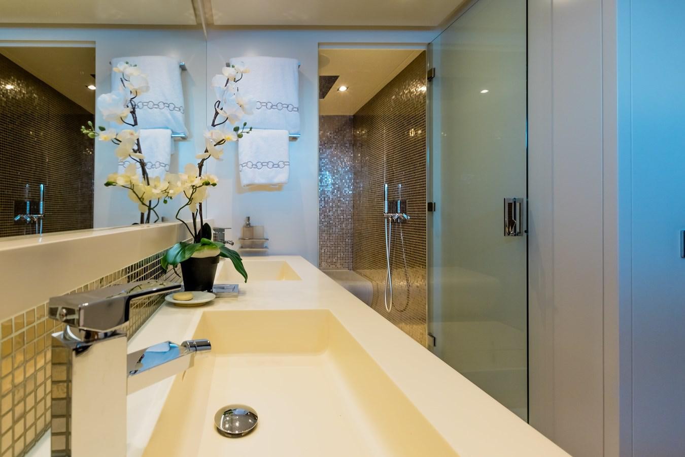 a bathroom with a sink and a mirror aboard KOLAHA TWO Yacht for Sale