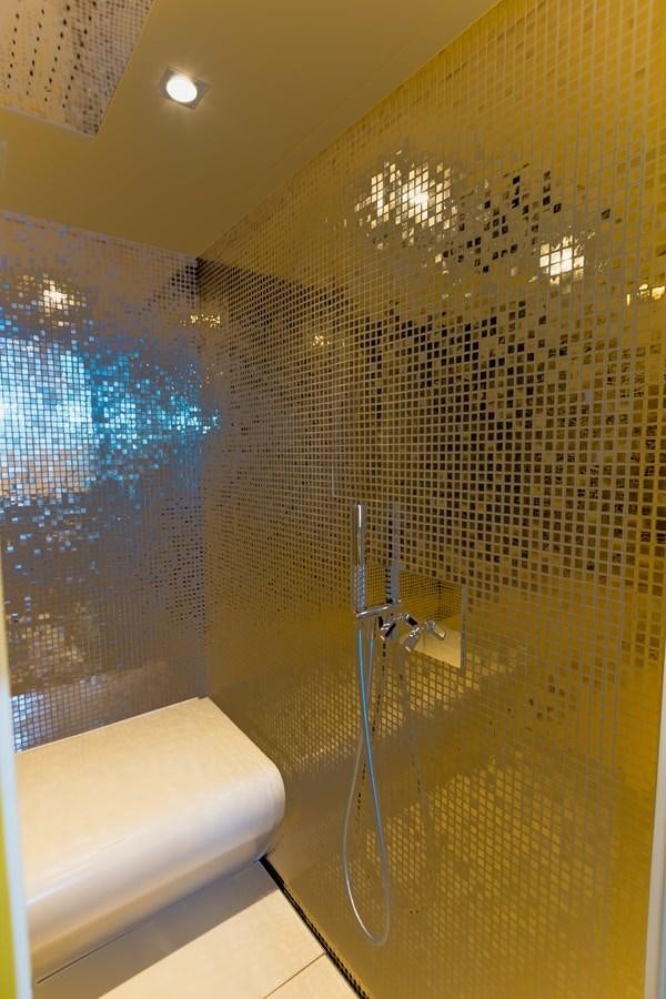 a bathroom with a glass shower aboard KOLAHA TWO Yacht for Sale