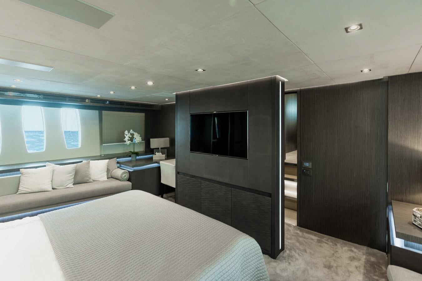 a room with a bed and a television aboard KOLAHA TWO Yacht for Sale