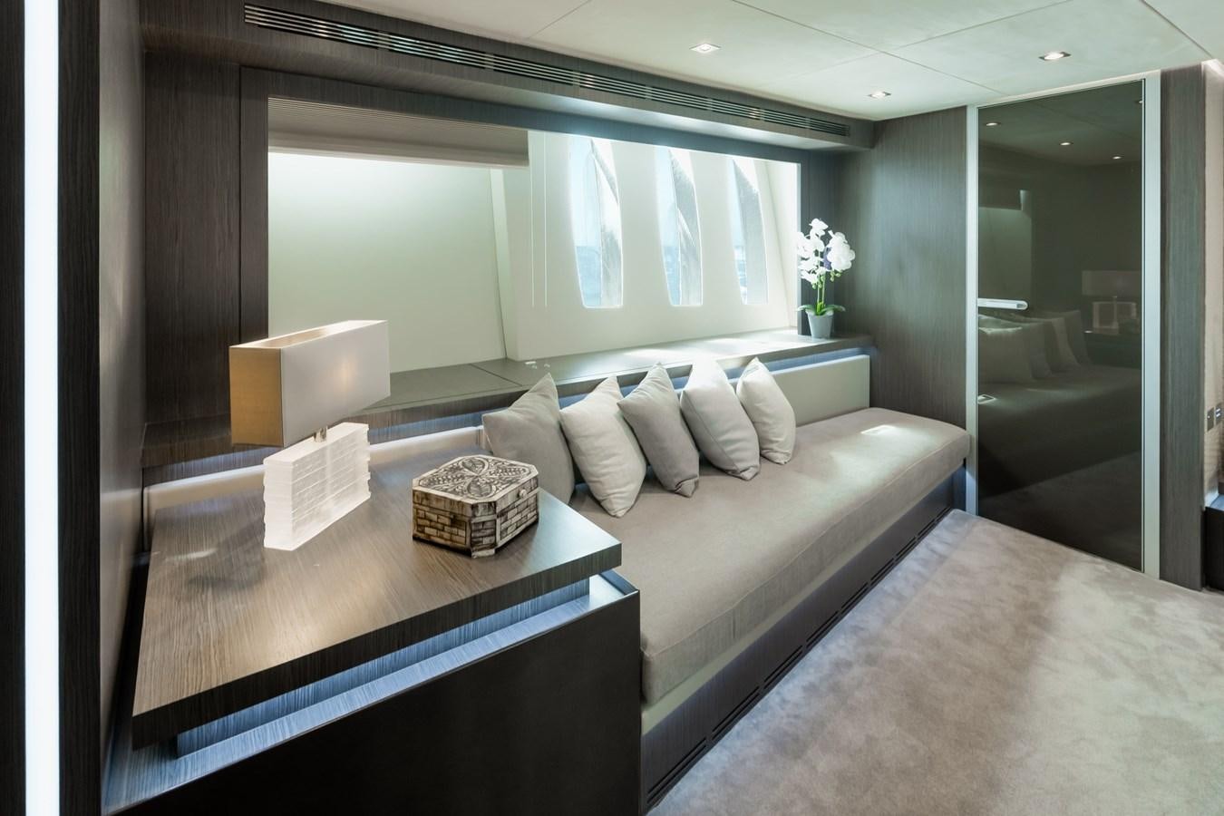 a room with a bed and a table aboard KOLAHA TWO Yacht for Sale