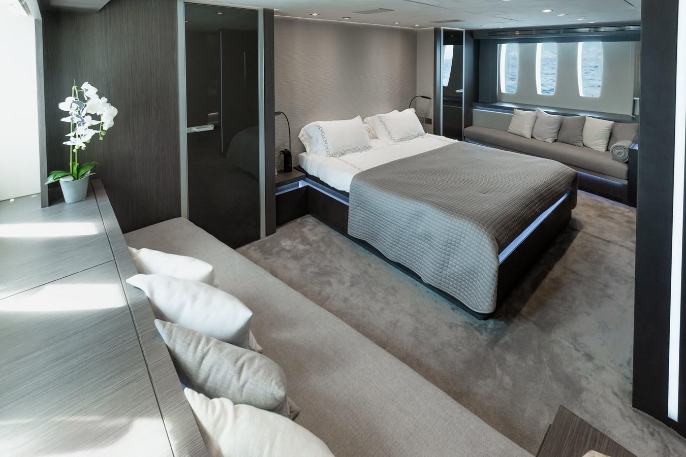 a room with a bed and a couch aboard KOLAHA TWO Yacht for Sale