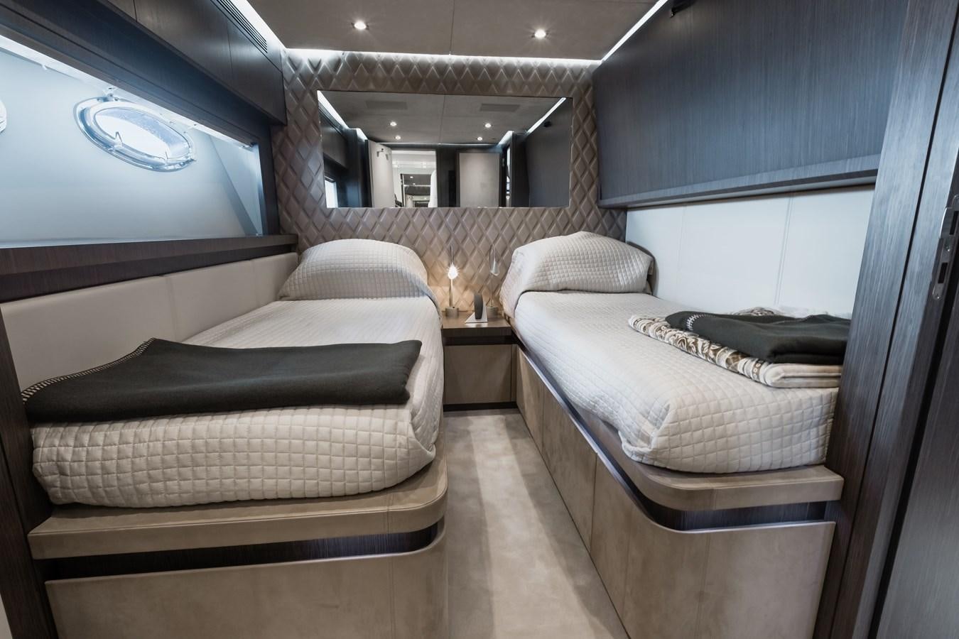 a room with a couple of beds aboard KOLAHA TWO Yacht for Sale