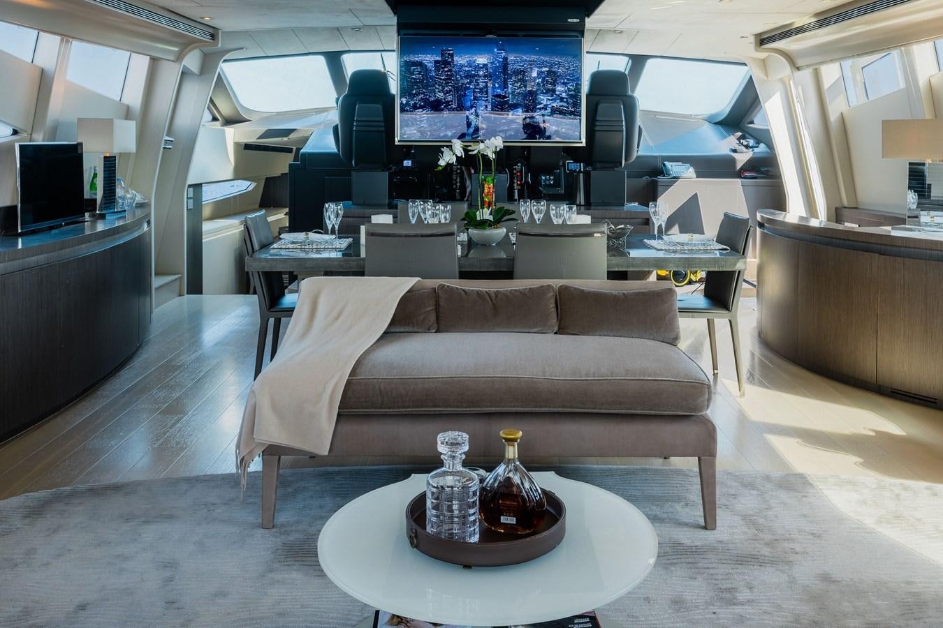 a living room with a couch and coffee table aboard KOLAHA TWO Yacht for Sale