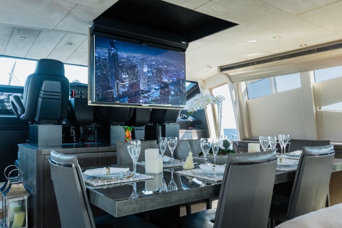 a room with a table and chairs aboard KOLAHA TWO Yacht for Sale