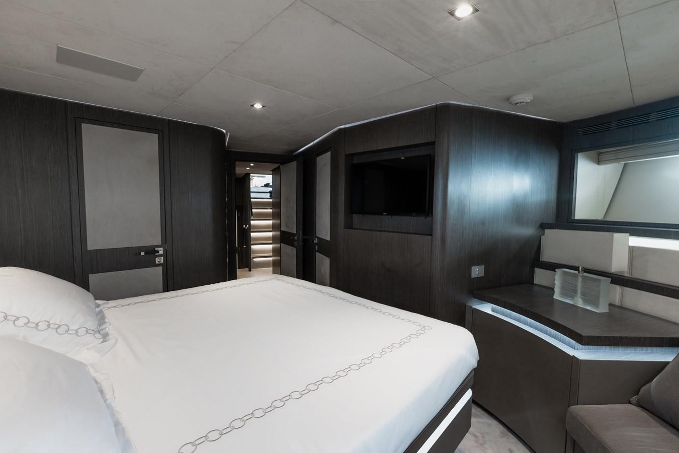 a large bedroom with a bed aboard KOLAHA TWO Yacht for Sale