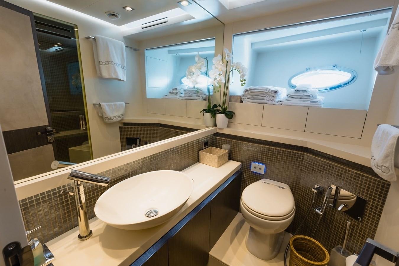 a bathroom with a large mirror aboard KOLAHA TWO Yacht for Sale