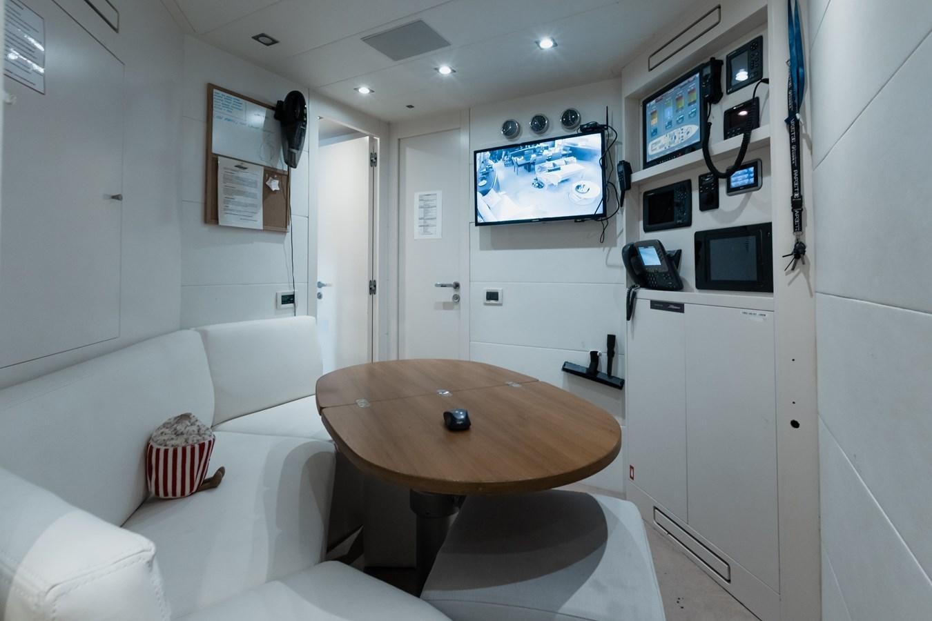 a room with a table and chairs aboard KOLAHA TWO Yacht for Sale