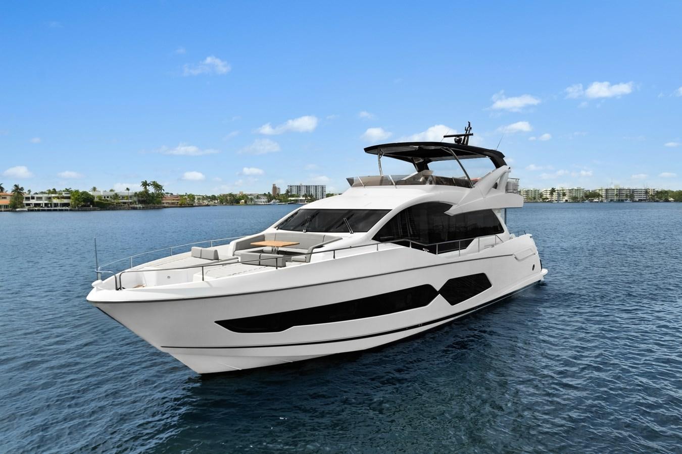 a white yacht on the water aboard MILAMO Yacht for Sale