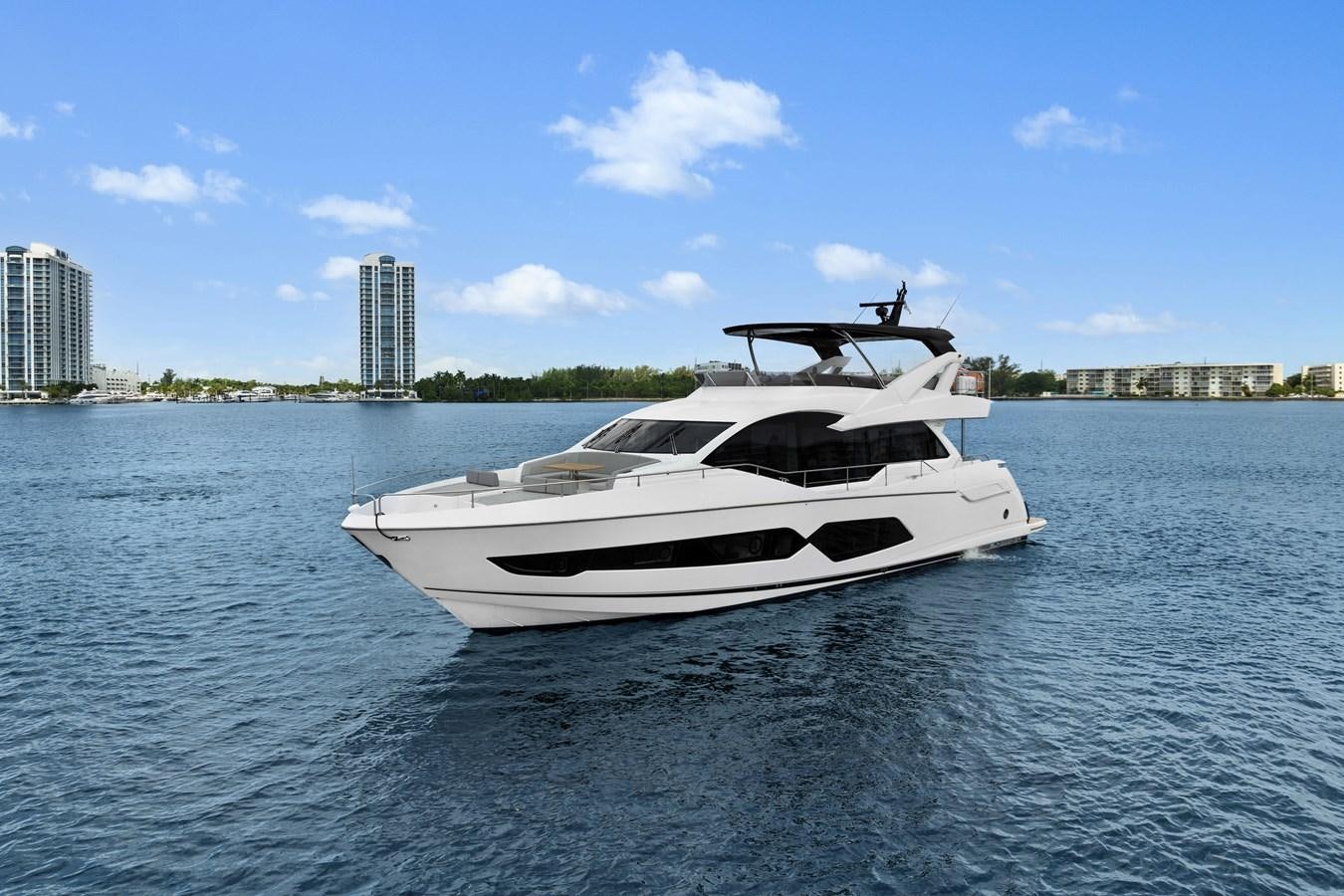 a white yacht on the water aboard MILAMO Yacht for Sale