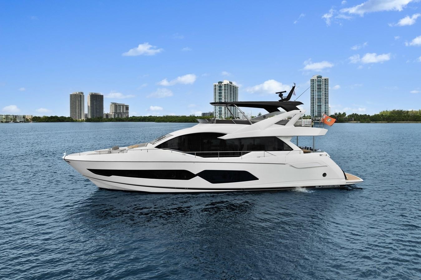 a white boat on the water aboard MILAMO Yacht for Sale