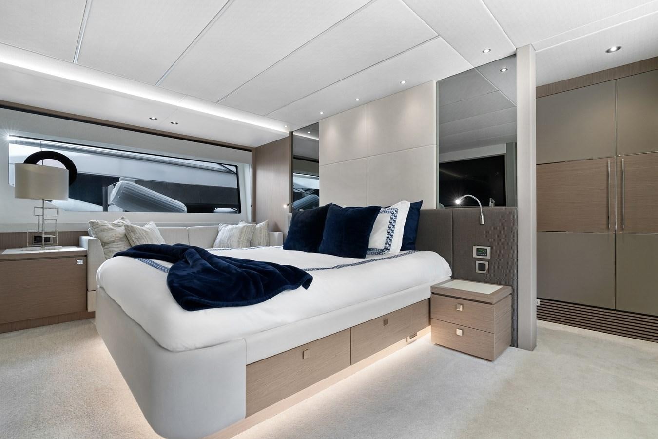 a room with a bed and a desk aboard MILAMO Yacht for Sale