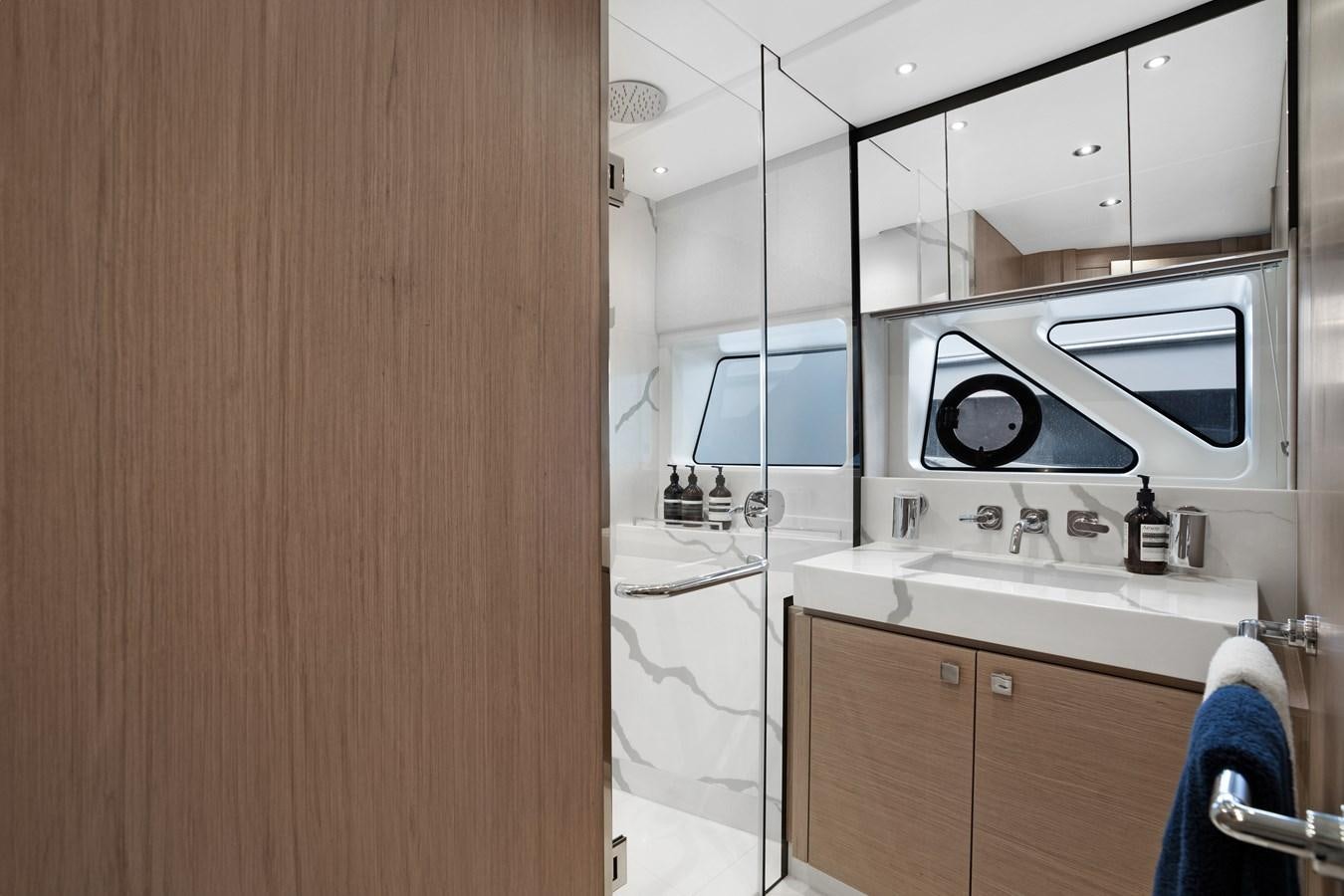 a kitchen with a sink and microwave aboard MILAMO Yacht for Sale
