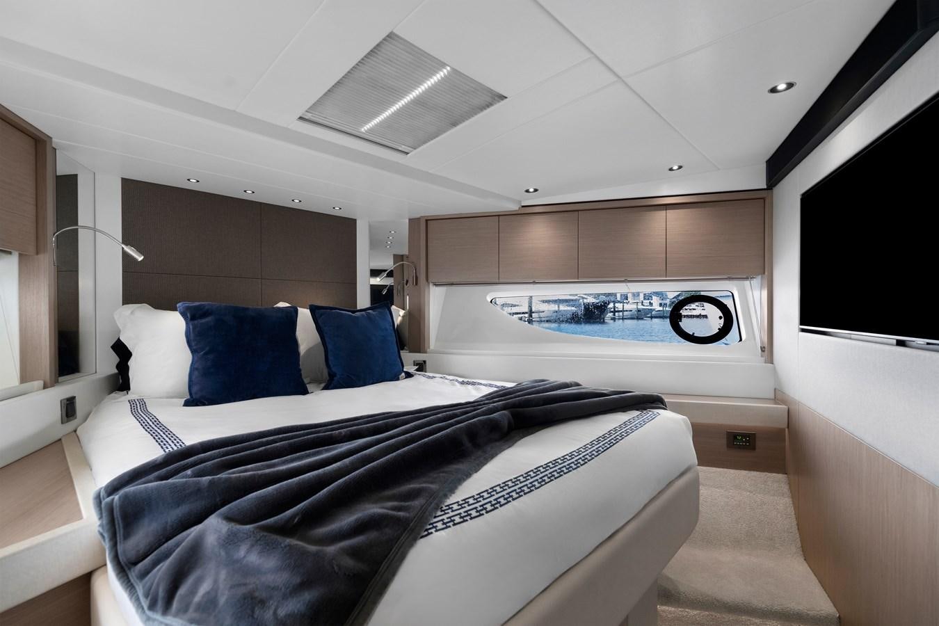 a large bed in a room aboard MILAMO Yacht for Sale