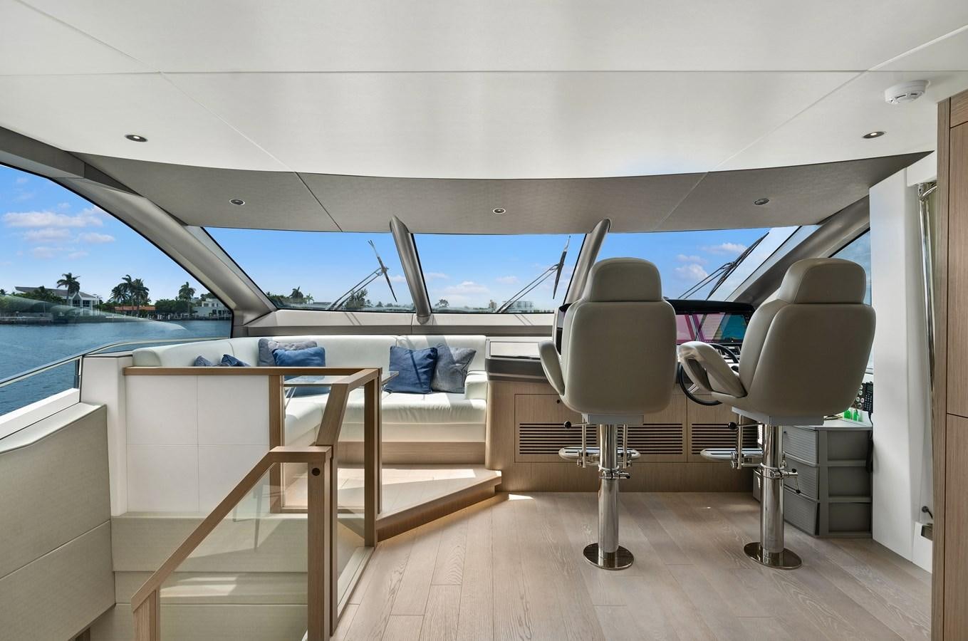 a room with a table and chairs aboard MILAMO Yacht for Sale
