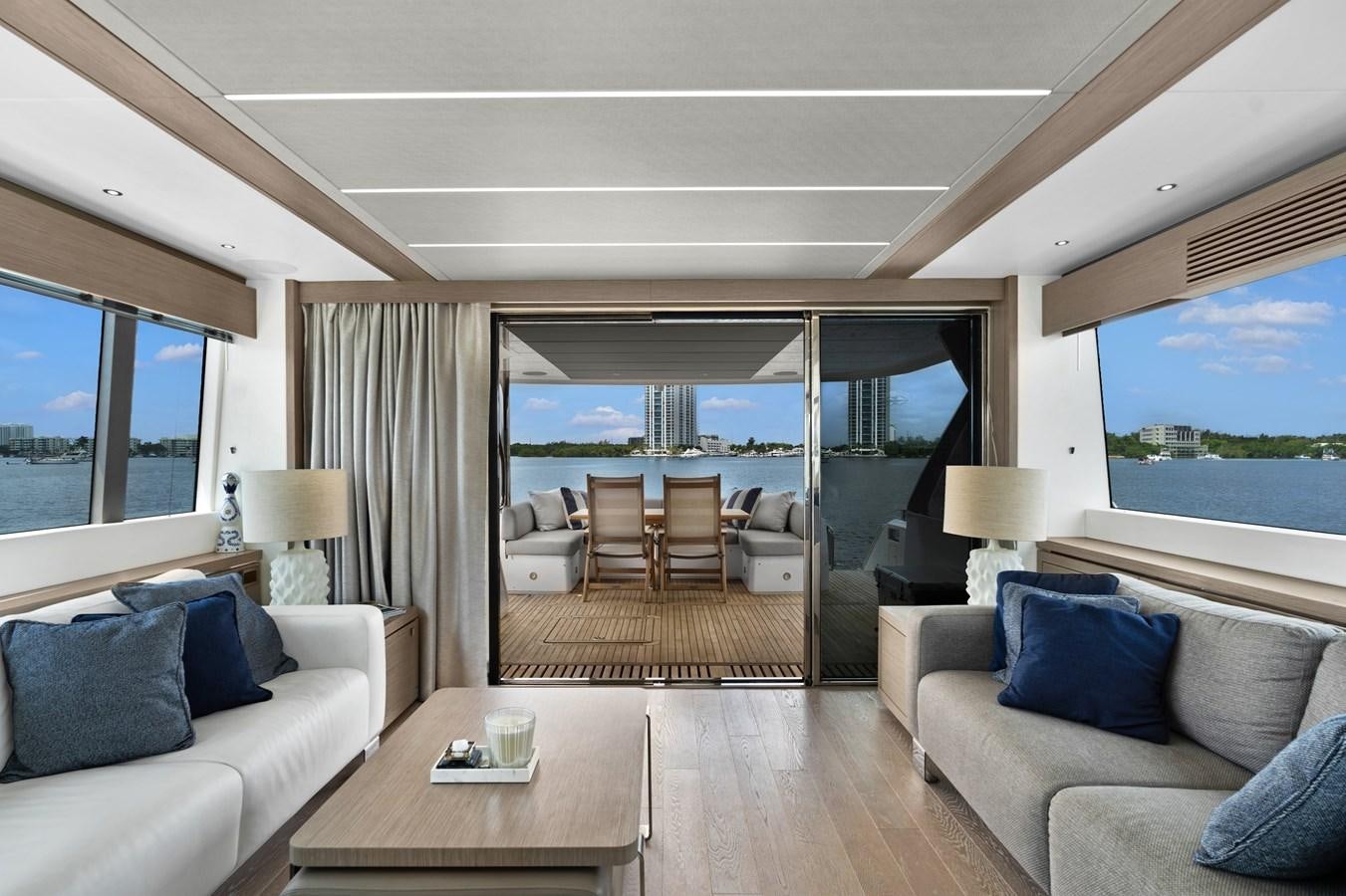 a living room with a large window aboard MILAMO Yacht for Sale