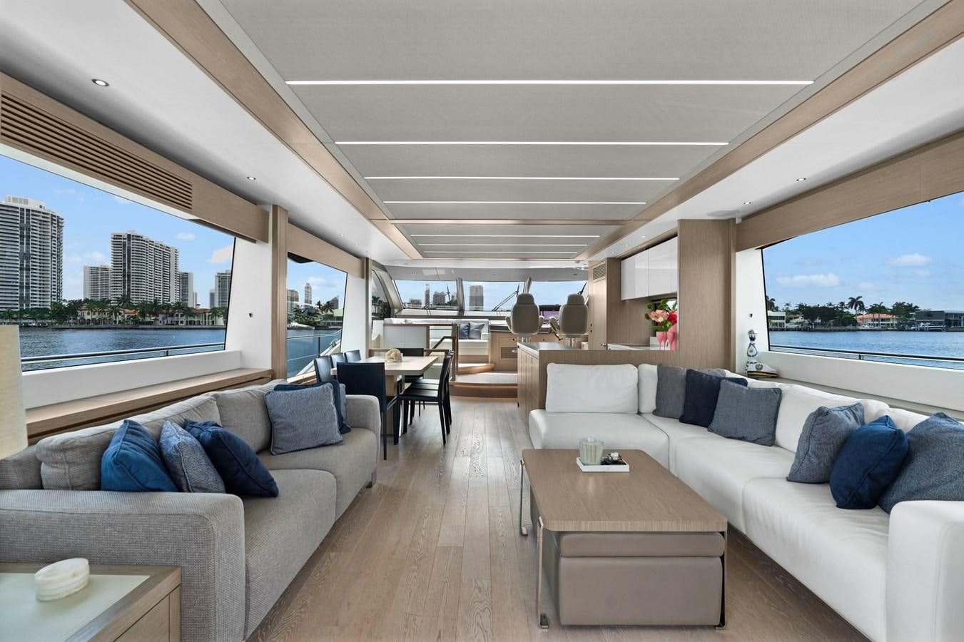 a living room with a large window aboard MILAMO Yacht for Sale