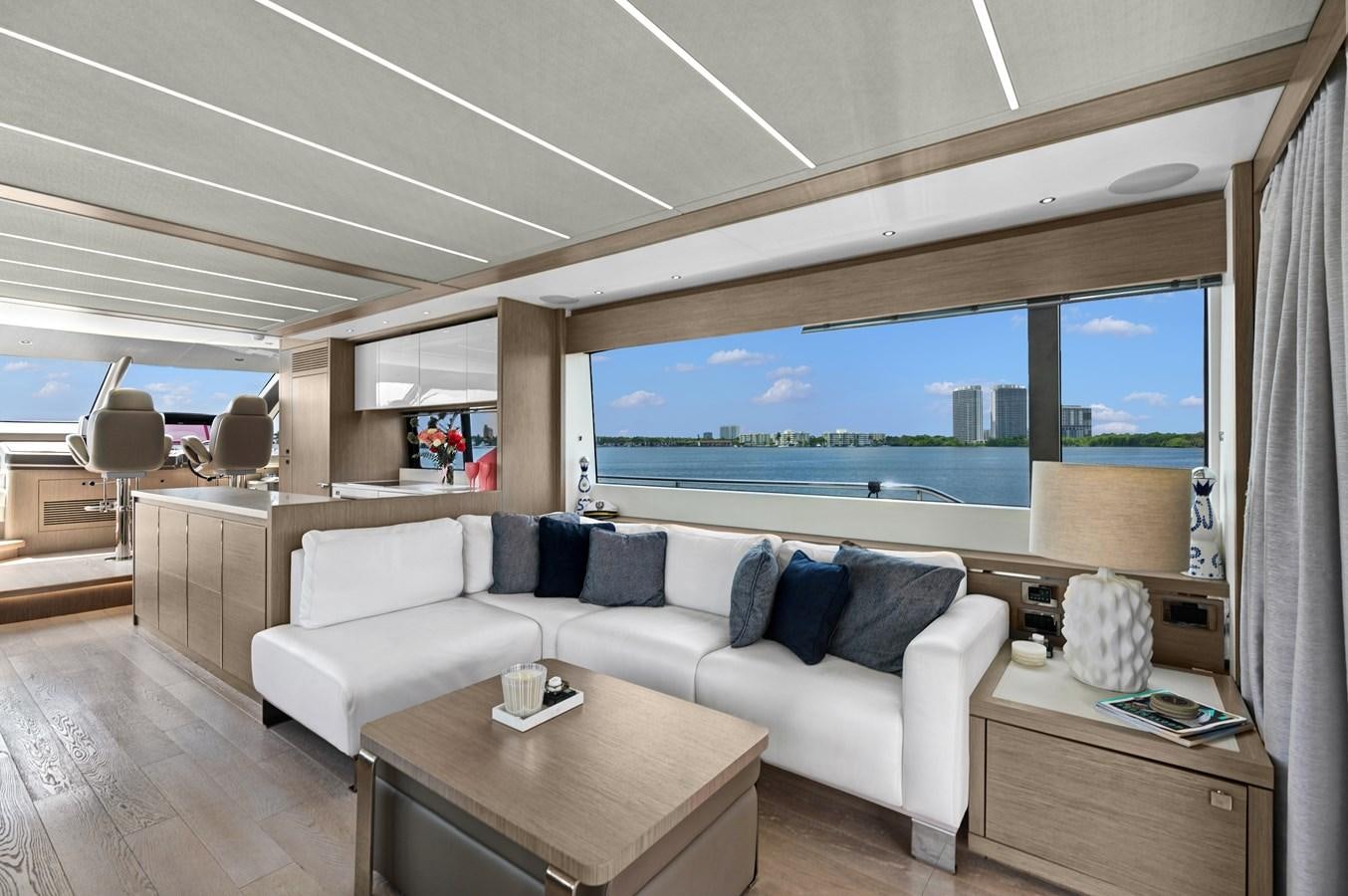 a living room with a large screen aboard MILAMO Yacht for Sale