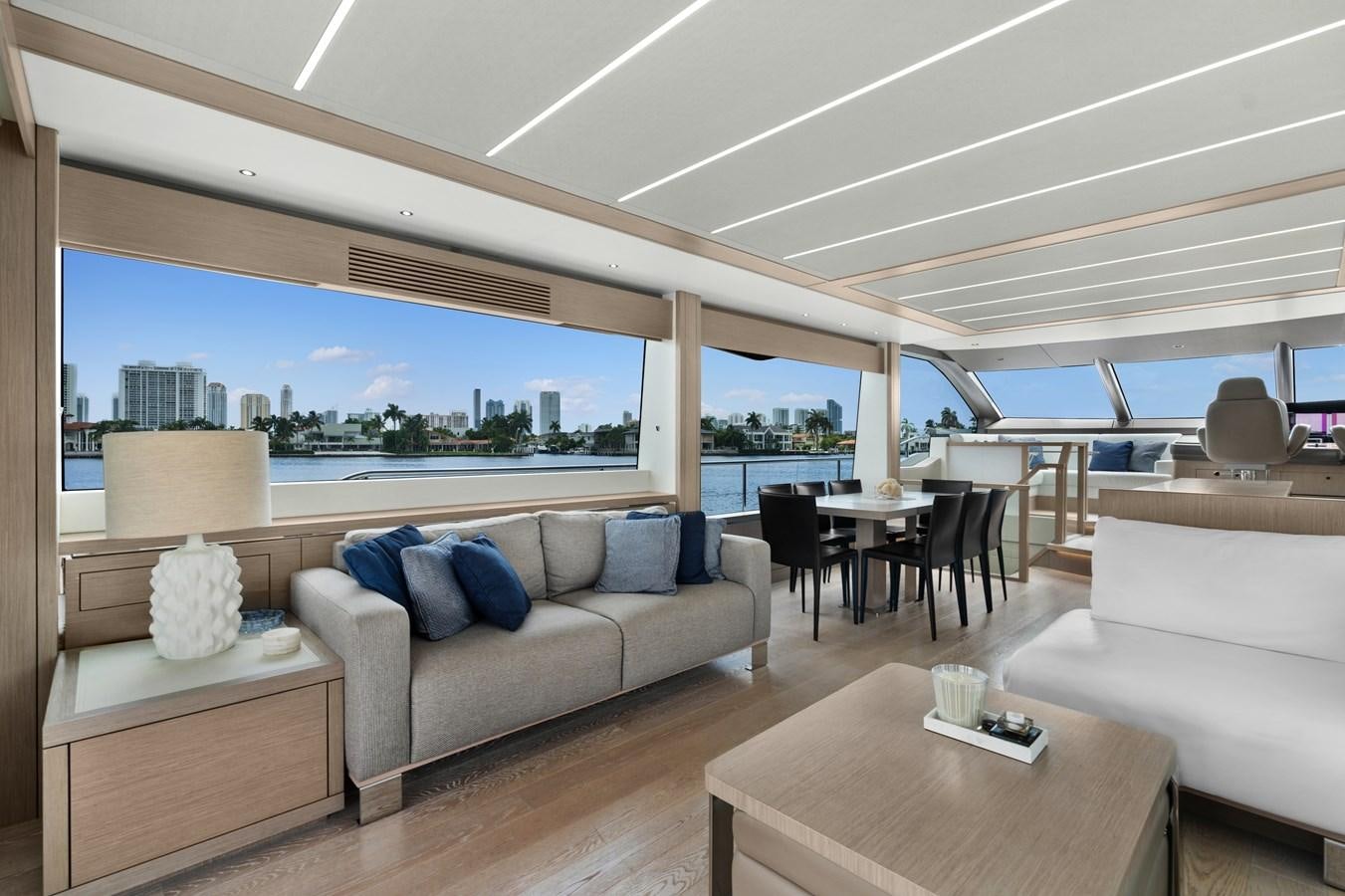 a living room with a large window aboard MILAMO Yacht for Sale