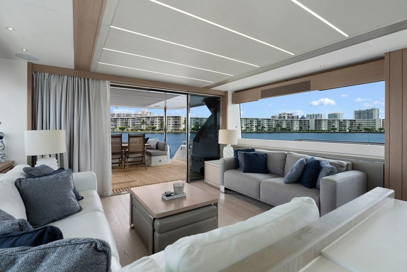 a living room with a large window aboard MILAMO Yacht for Sale