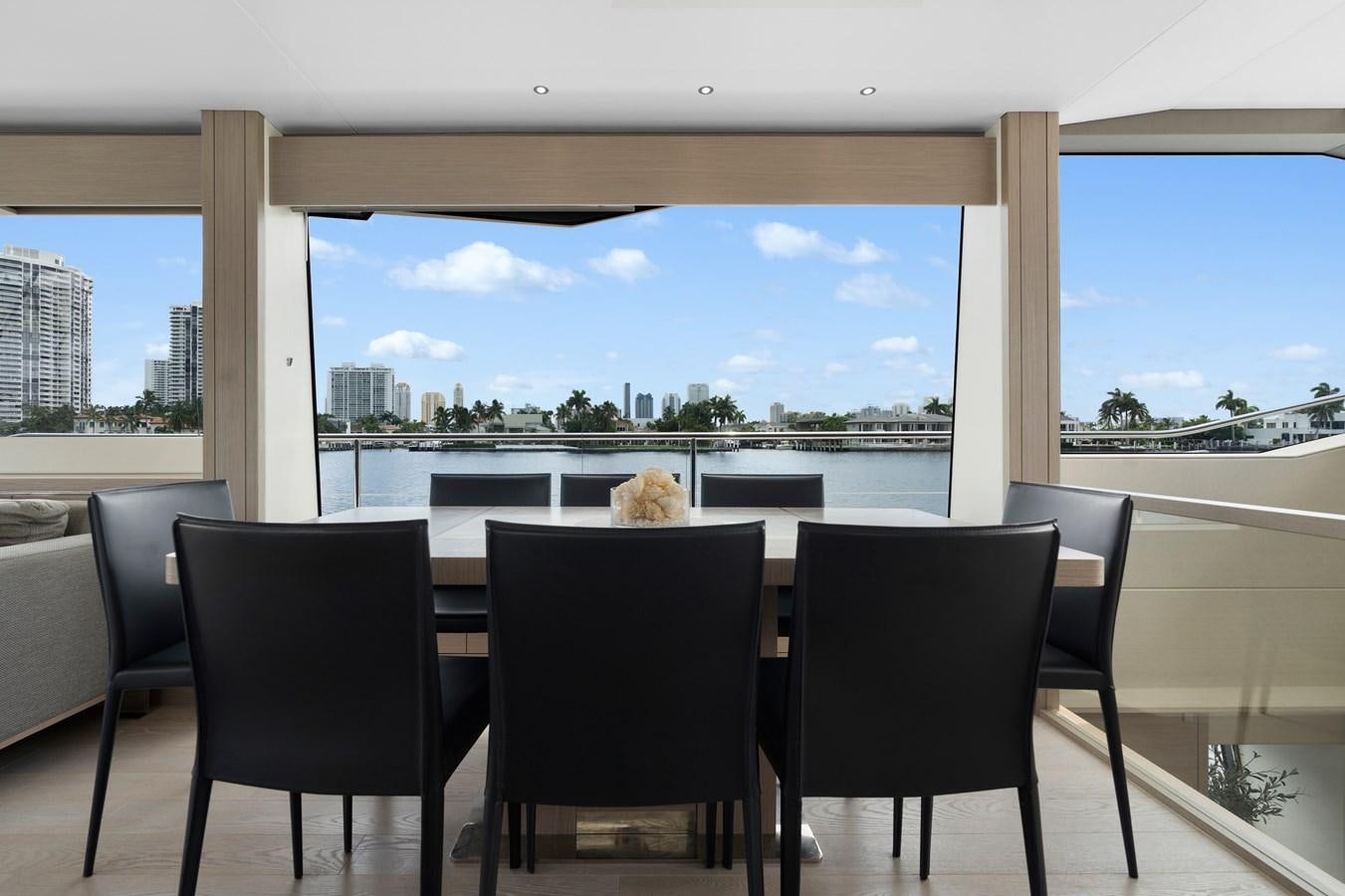 a room with chairs and a table aboard MILAMO Yacht for Sale