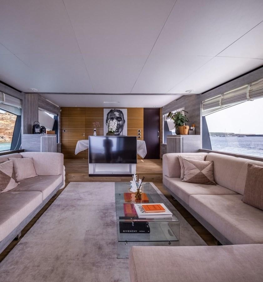 a living room with a large television aboard BYSCAINE Yacht for Sale