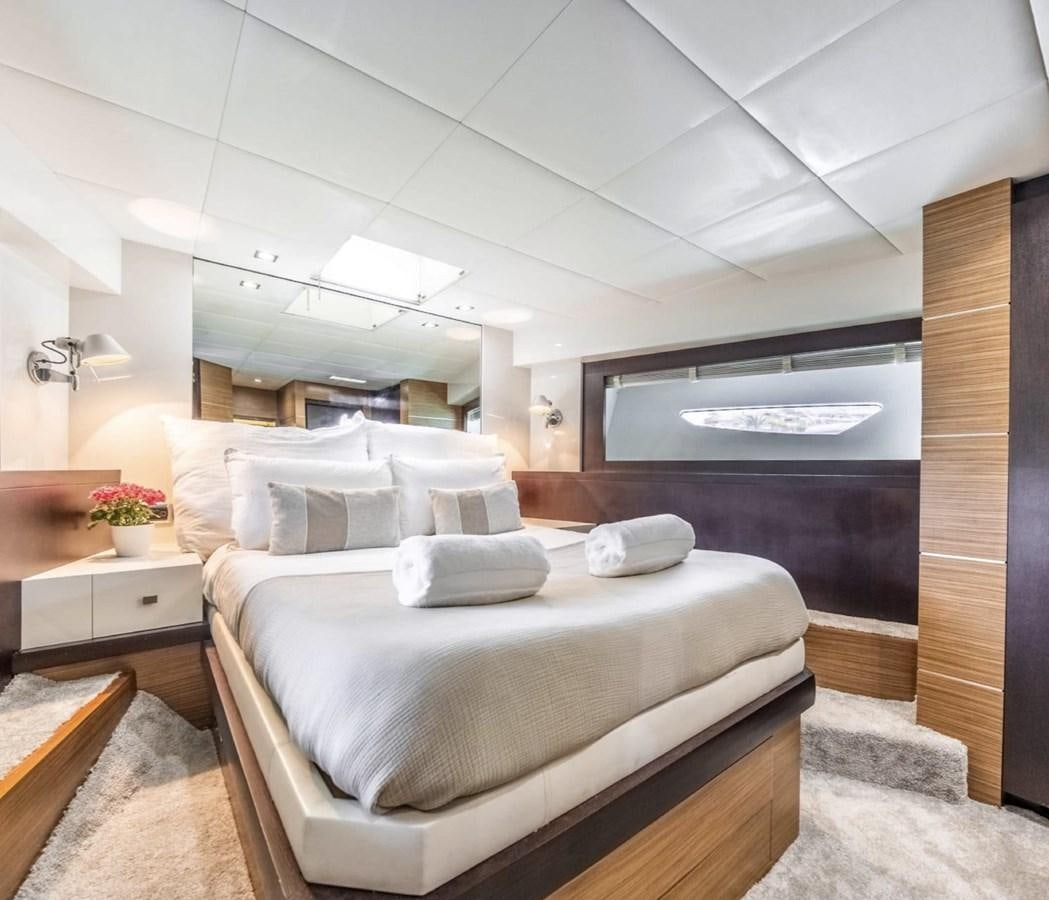 a room with a bed and a television aboard BYSCAINE Yacht for Sale