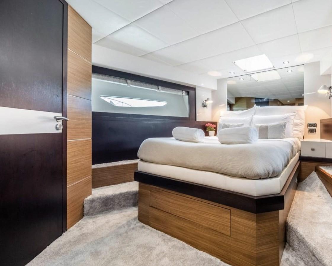 a room with a bed and a closet aboard BYSCAINE Yacht for Sale