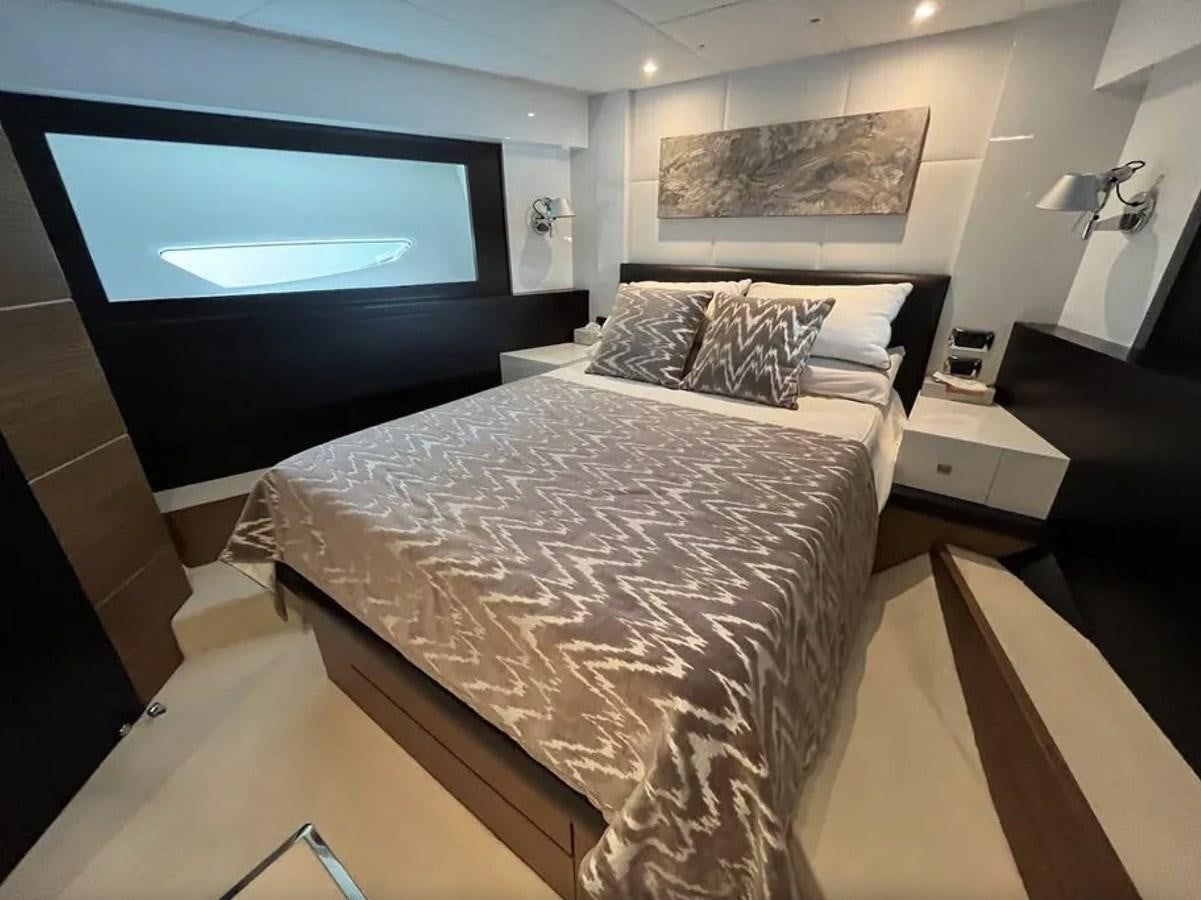 a bedroom with a large bed aboard BYSCAINE Yacht for Sale