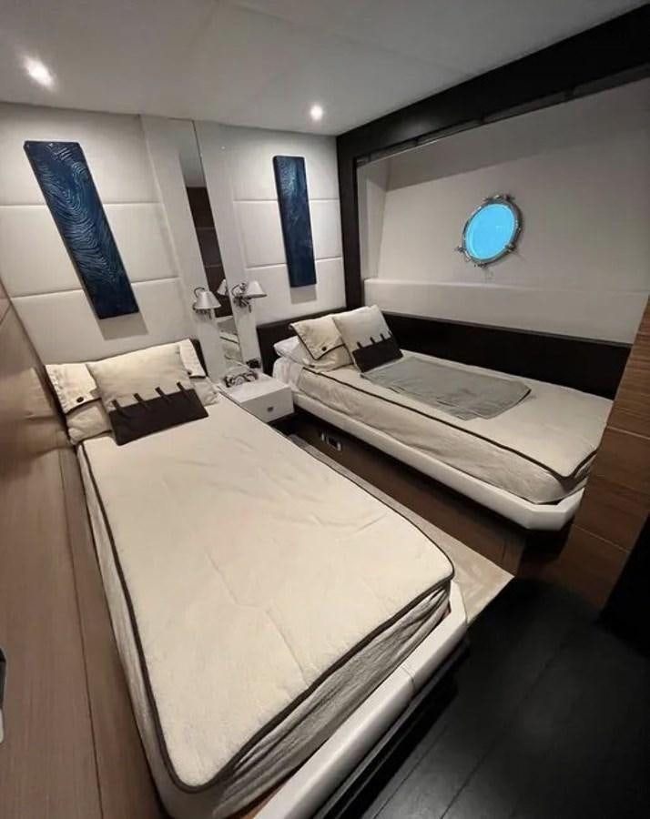 a room with two beds aboard BYSCAINE Yacht for Sale