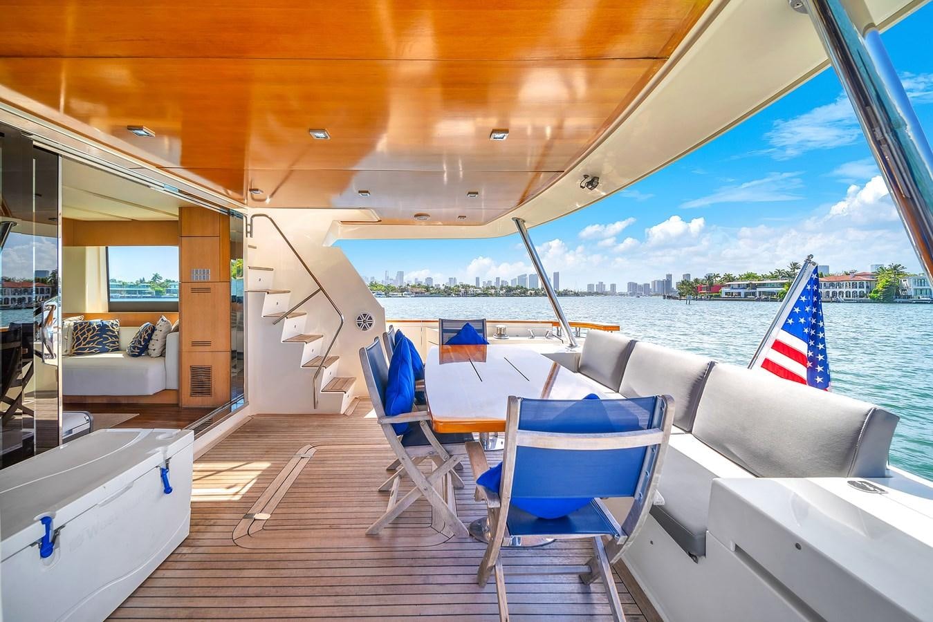 a deck with chairs and a view of the water aboard AICON 85 Yacht for Sale