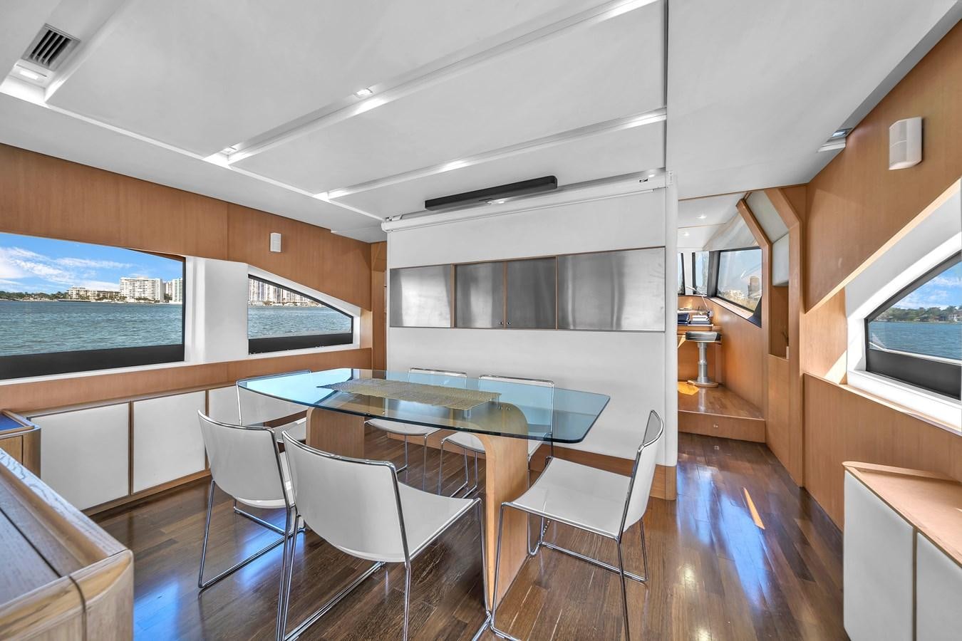a room with a table and chairs aboard AICON 85 Yacht for Sale