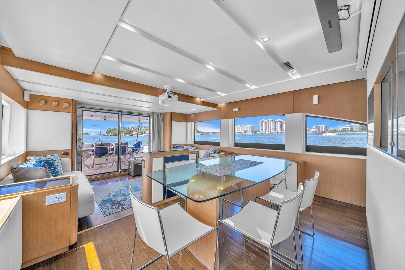 a large living room with a pool table and chairs aboard AICON 85 Yacht for Sale