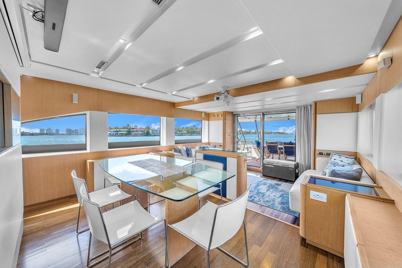 a room with a table and chairs aboard AICON 85 Yacht for Sale